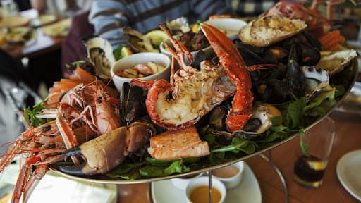 different types of lobster served on large platter