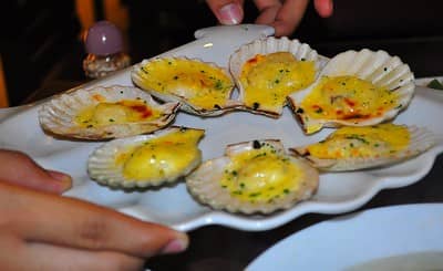 oven cooked scallops topped with cheese